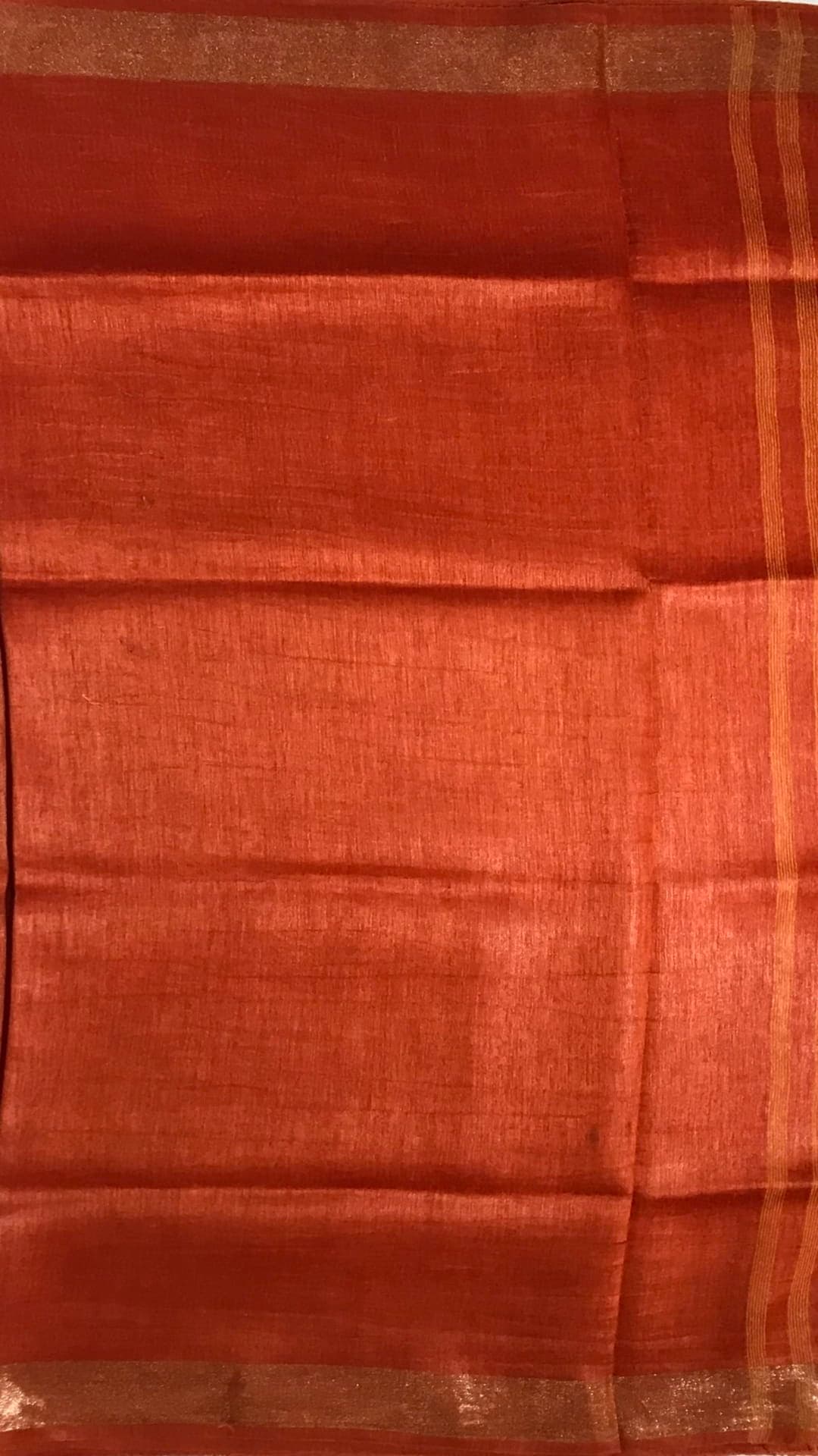 Orange silk linen saree with cutwork pallu