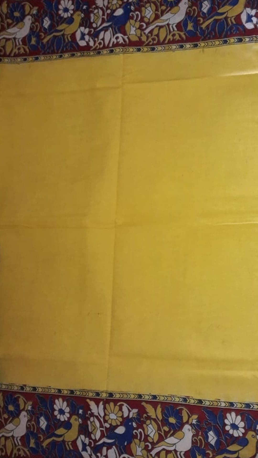 Yellow kalamkari saree with maroon border & colorful flower & bird design